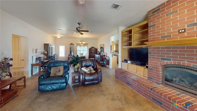 a lobby with furniture and a potted plant