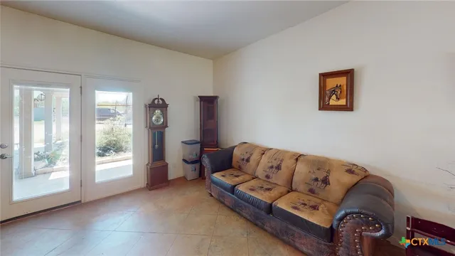 a kitchen with refrigerator and cabinets