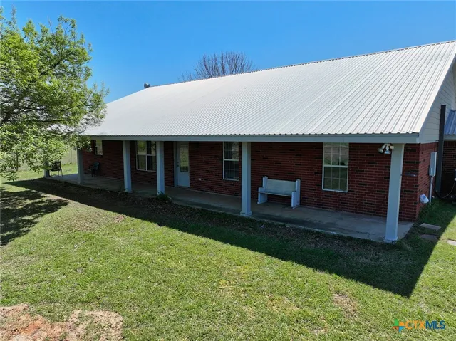 a front view of a house with a patio