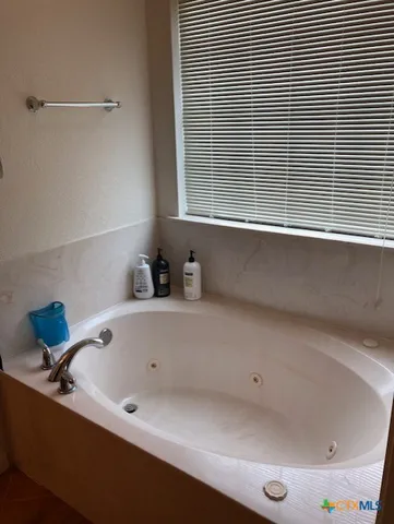 a bed room with a bed and a baby bed