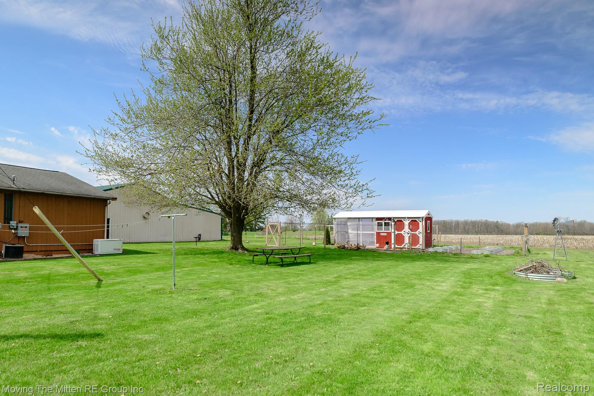 9260 Pitman Road Ypsilanti, MI 48197 - Photo 31 of 45 View of yard featuring a storage unit