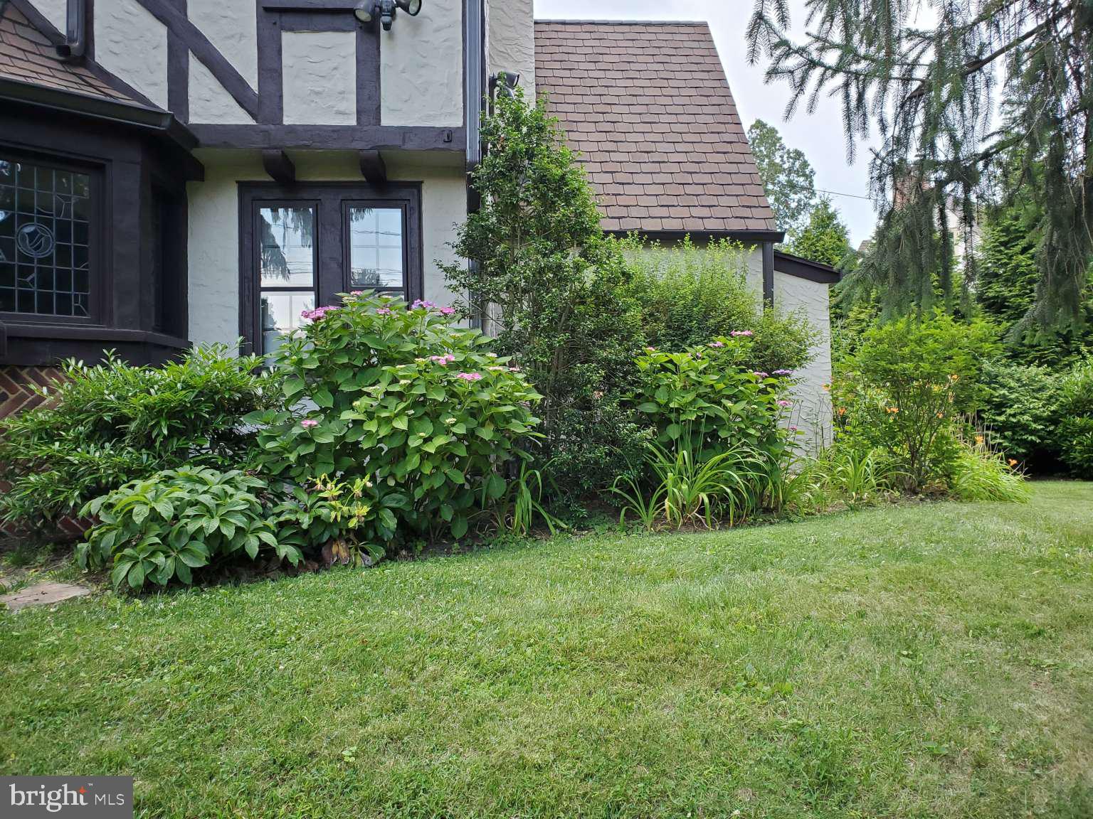 273 Strafford Avenue Wayne, PA 19087 - Photo 40 of 42 a view of a house with a yard and plants