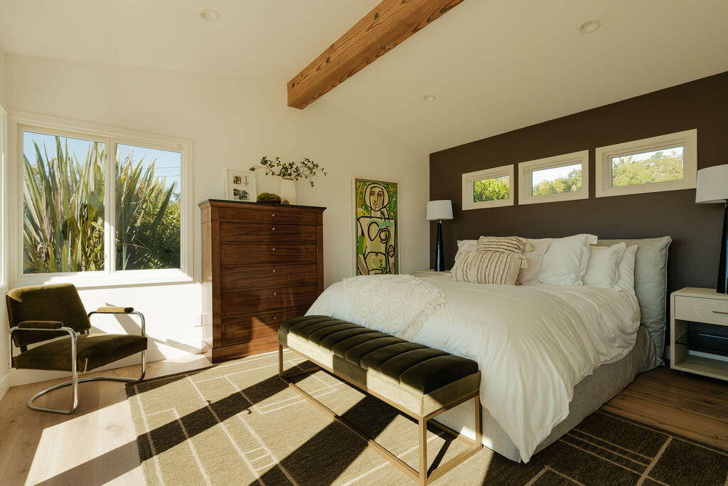 415 Yankee Farm Road Santa Barbara, CA 93109 - Photo 13 of 25 a bedroom with a bed and wooden floor