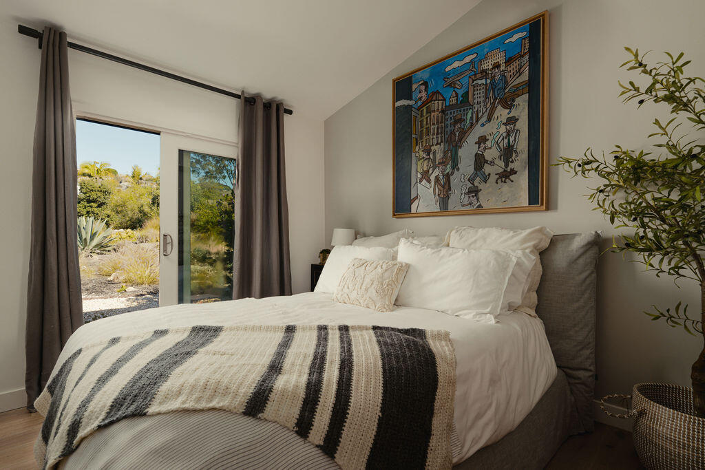 415 Yankee Farm Road Santa Barbara, CA 93109 - Photo 17 of 25 a bed sitting in a bedroom next to a window