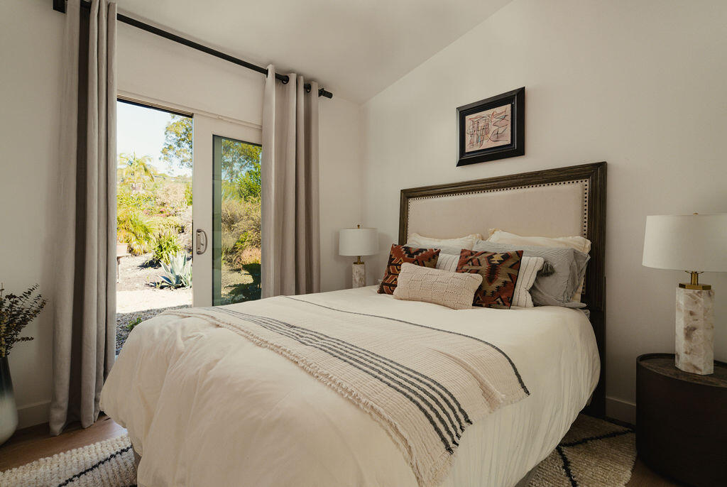 415 Yankee Farm Road Santa Barbara, CA 93109 - Photo 19 of 25 a bedroom with a large bed and a window