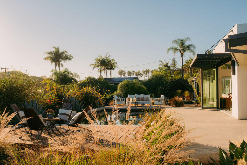 415 Yankee Farm Road Santa Barbara, CA 93109 - Photo 21 of 25 a view of a chair and tables in patio