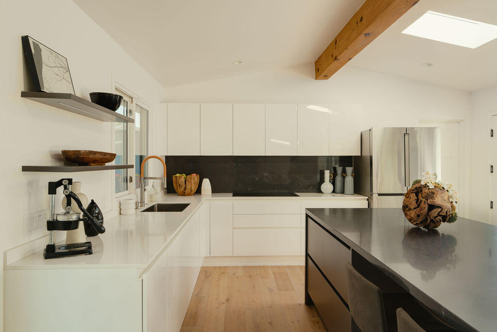 415 Yankee Farm Road Santa Barbara, CA 93109 - Photo 8 of 25 a kitchen with a sink and a refrigerator