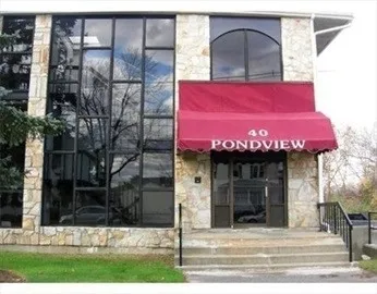 a view of a building with a tree