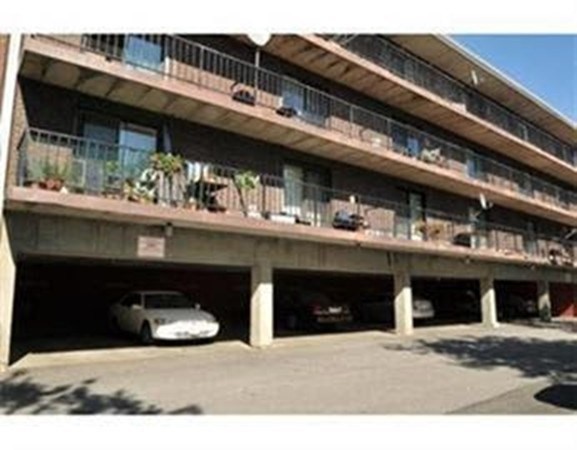 40 Cochituate Road, Unit 40 Framingham, MA 01701 - Photo 3 of 12 a black and white building with black white umbrella