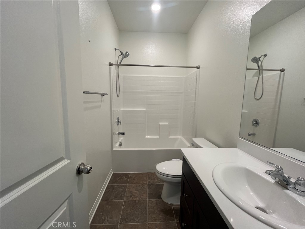 5233 Saloon Street Hemet, CA 92545 - Photo 16 of 18 a bathroom with a sink toilet and shower