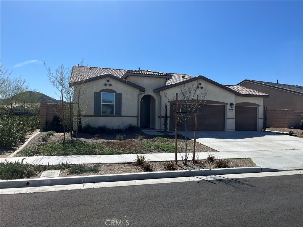 5233 Saloon Street Hemet, CA 92545 - Photo 3 of 18 a front view of a house with garage