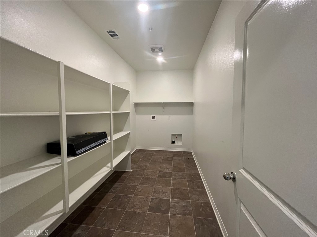 5233 Saloon Street Hemet, CA 92545 - Photo 5 of 18 a bathroom with a double vanity sink and a toilet