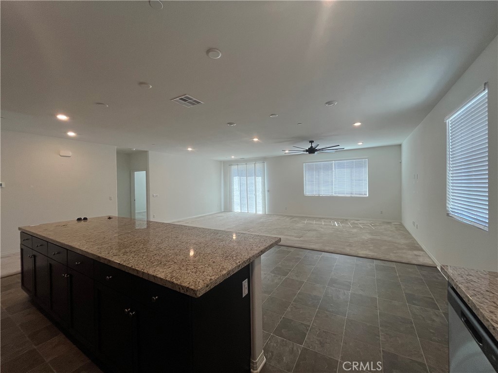 5233 Saloon Street Hemet, CA 92545 - Photo 9 of 18 a kitchen with a sink refrigerator and a window