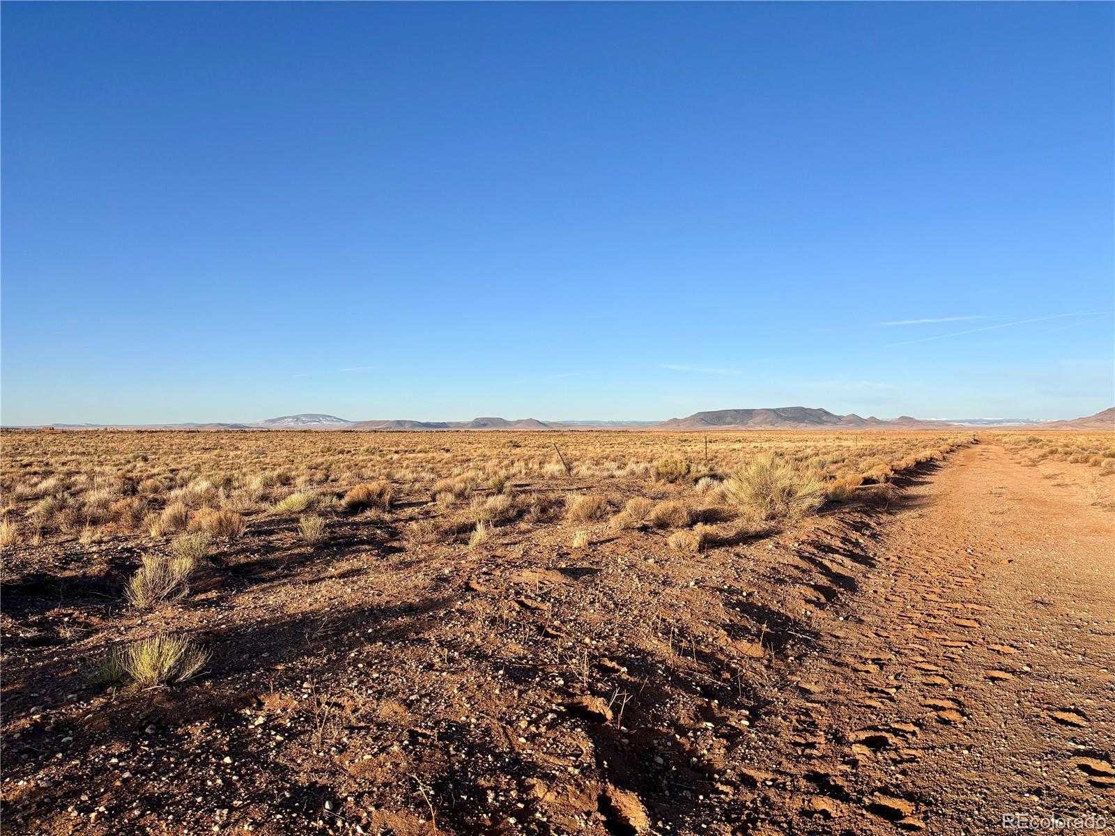 2 Don Road Sanford, CO 81151 - Photo 7 of 15 an aerial view of ocean and trees