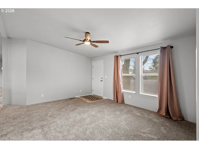 a view of kitchen with cabinets and stainless steel appliances