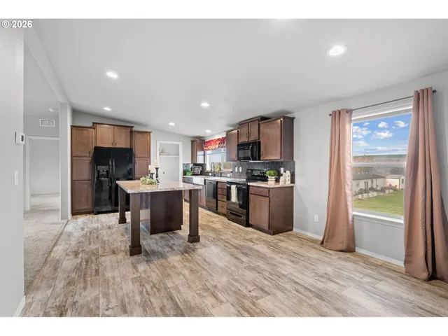 a view of a livingroom with furniture and a window