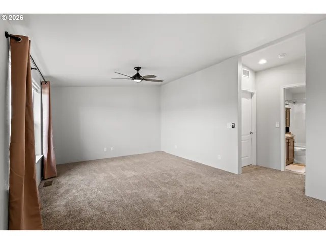 a view of an empty room and window