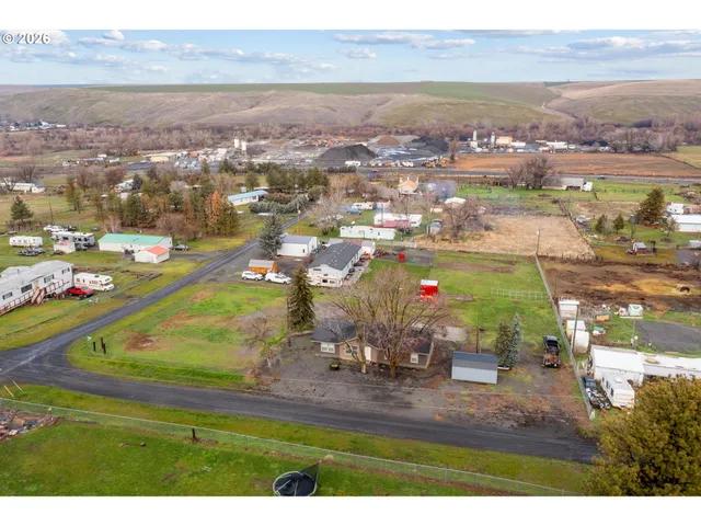 an aerial view of residential houses with outdoor space