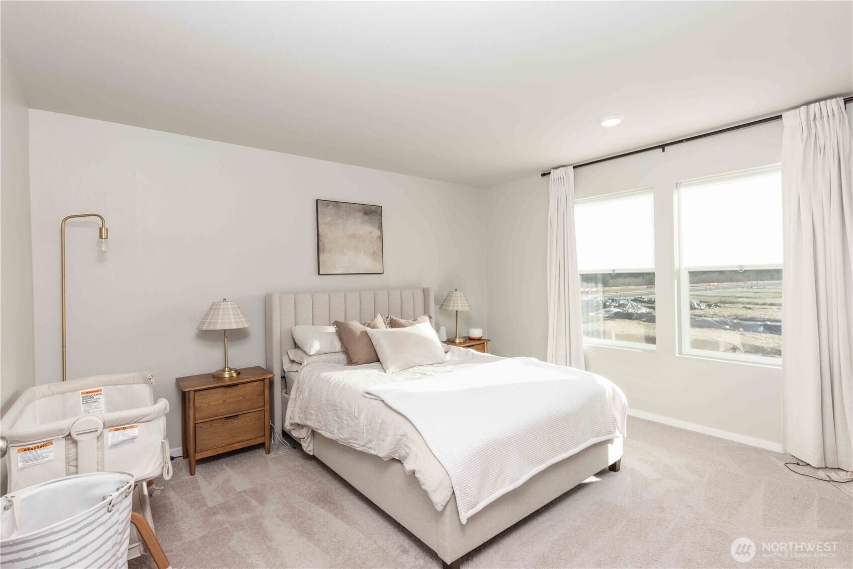 1164 Southwest Pendleton Way Port Orchard, WA 98367 - Photo 12 of 32 a bedroom with a bed and a large window