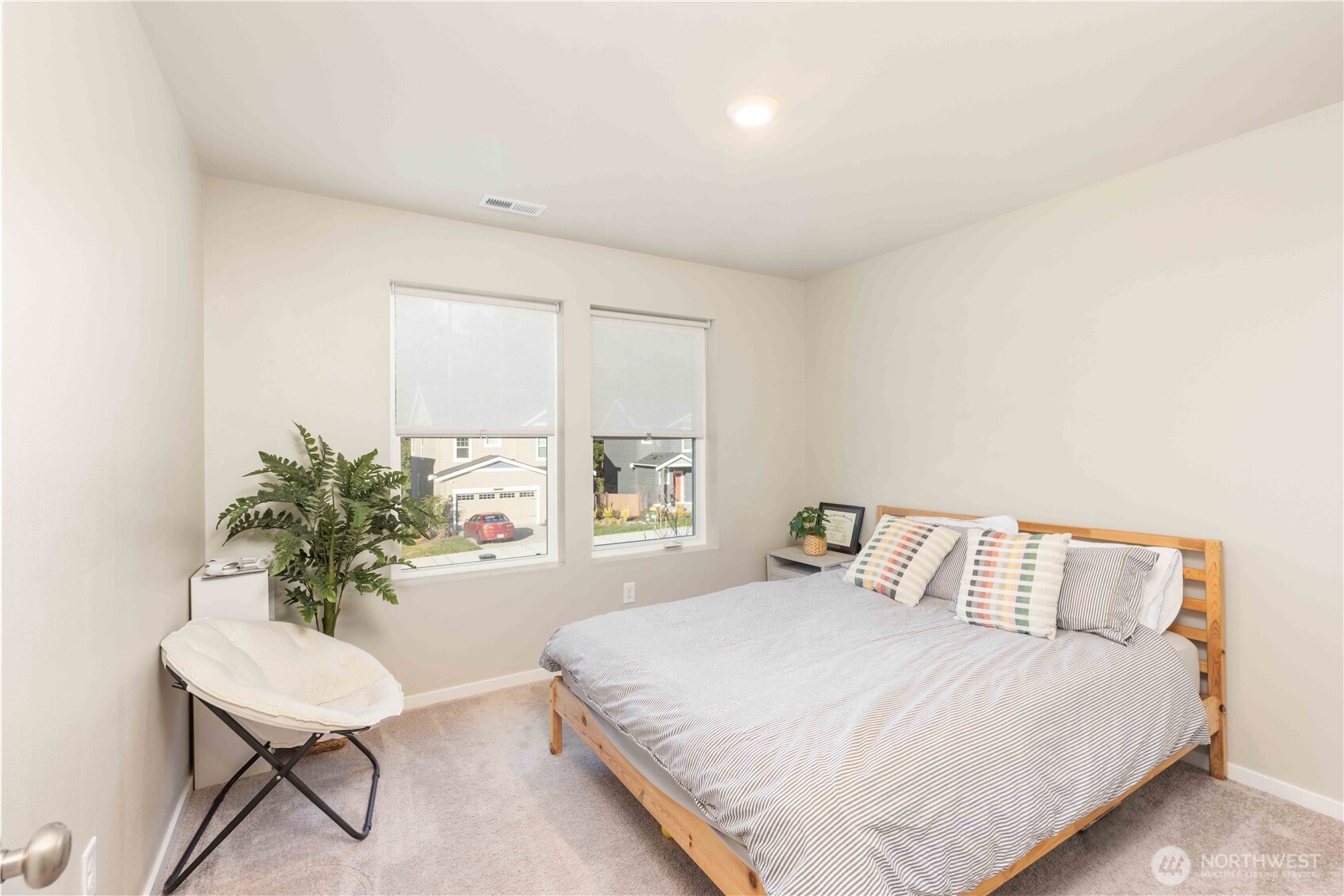 1164 Southwest Pendleton Way Port Orchard, WA 98367 - Photo 16 of 32 a bedroom with a bed table and a window