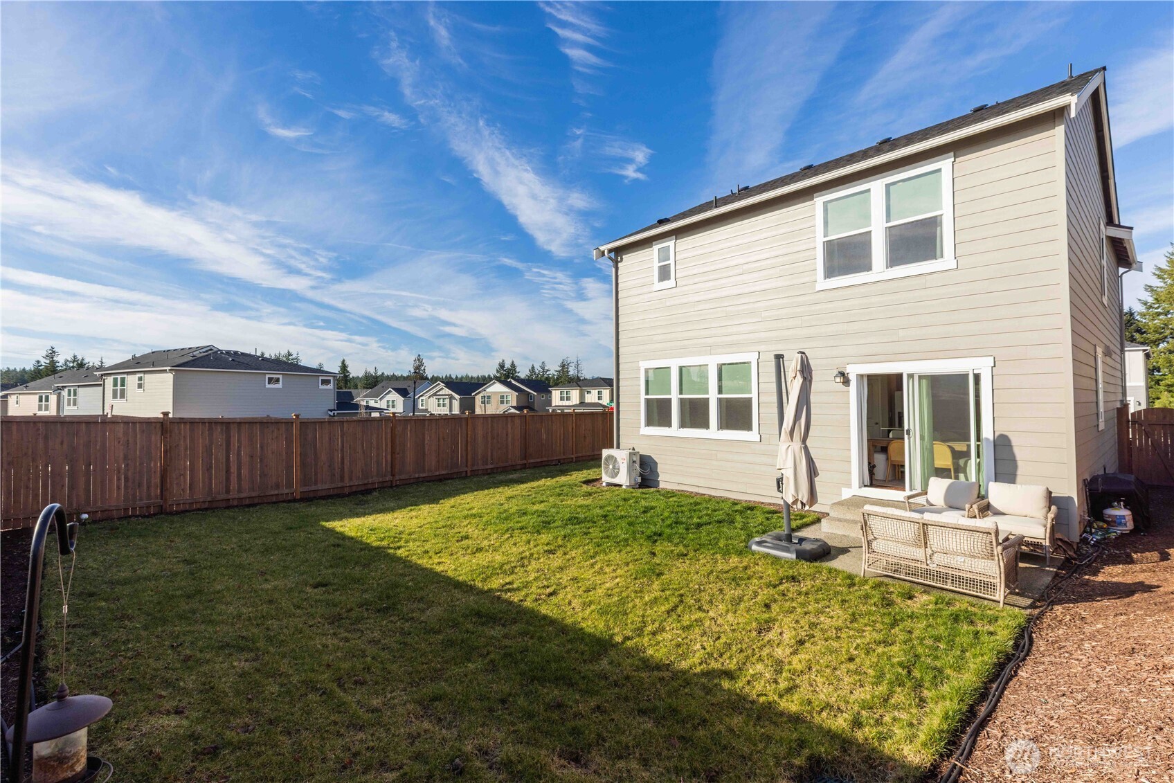 1164 Southwest Pendleton Way Port Orchard, WA 98367 - Photo 22 of 32 a view of a house with backyard porch and sitting area