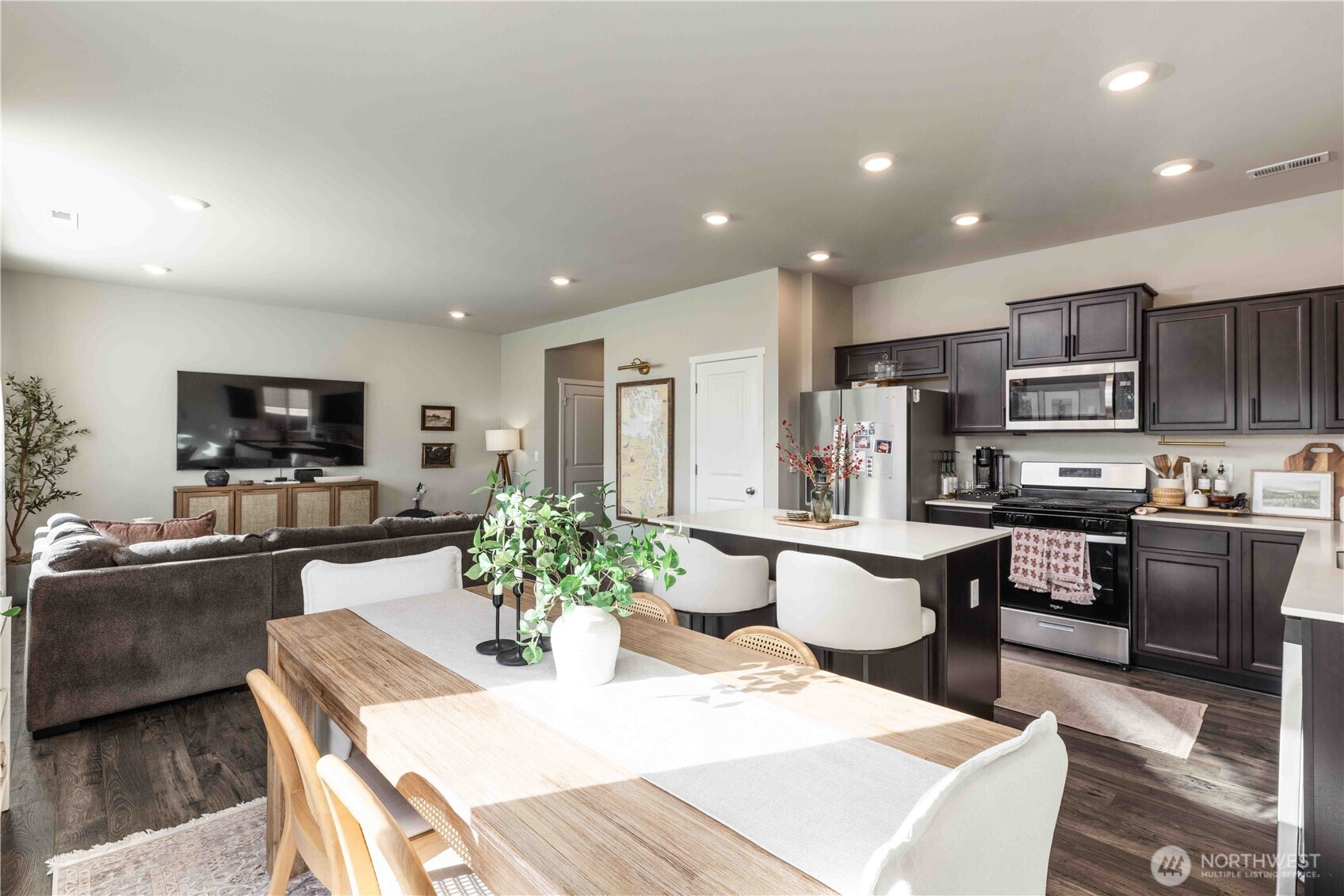 1164 Southwest Pendleton Way Port Orchard, WA 98367 - Photo 7 of 32 a kitchen with microwave a sink and chairs