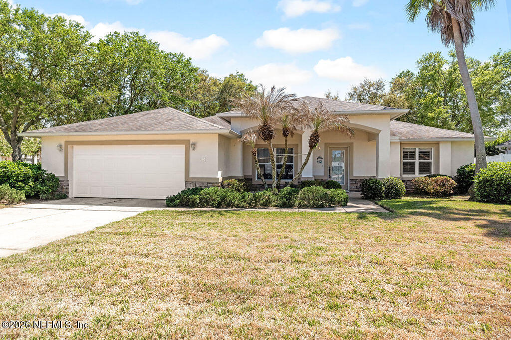 8 Peruvian Lane Ormond Beach, FL 32174 - Photo 1 of 40 a front view of a house with a yard