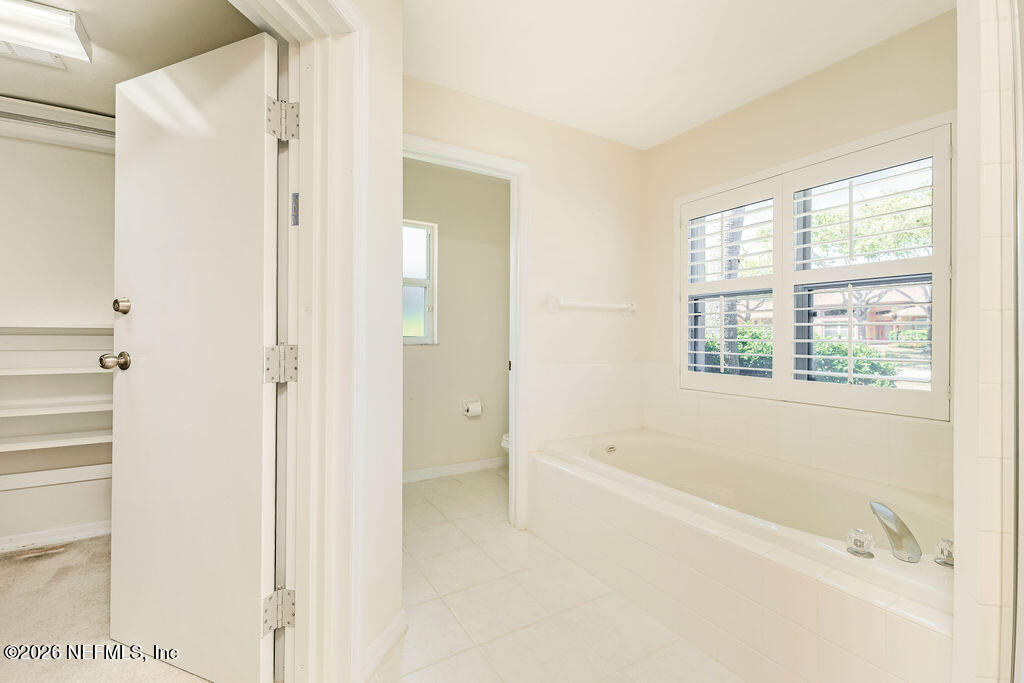 8 Peruvian Lane Ormond Beach, FL 32174 - Photo 13 of 40 a bathroom with a bathtub and shower
