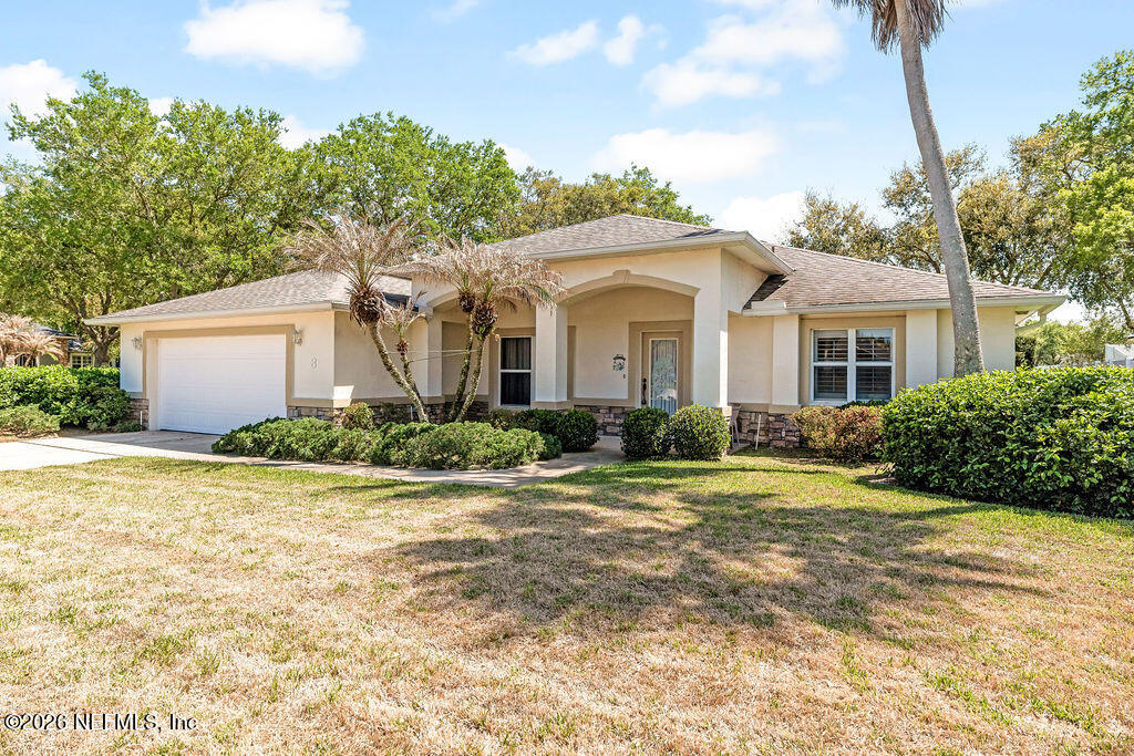 8 Peruvian Lane Ormond Beach, FL 32174 - Photo 2 of 40 a front view of a house with garden