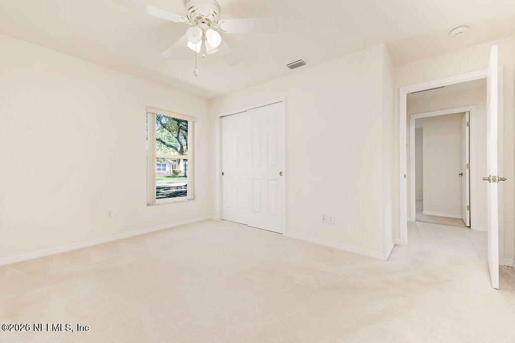 8 Peruvian Lane Ormond Beach, FL 32174 - Photo 22 of 40 an empty room with windows and closet