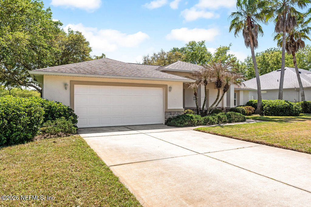 8 Peruvian Lane Ormond Beach, FL 32174 - Photo 3 of 40 a front view of a house with garden