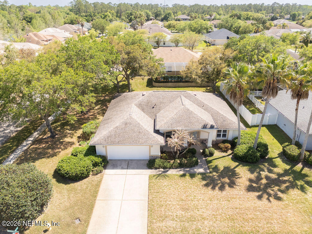 8 Peruvian Lane Ormond Beach, FL 32174 - Photo 32 of 40 an aerial view of a house with a yard and lake view