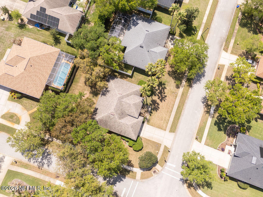 8 Peruvian Lane Ormond Beach, FL 32174 - Photo 37 of 40 an aerial view of a house with a yard and garden