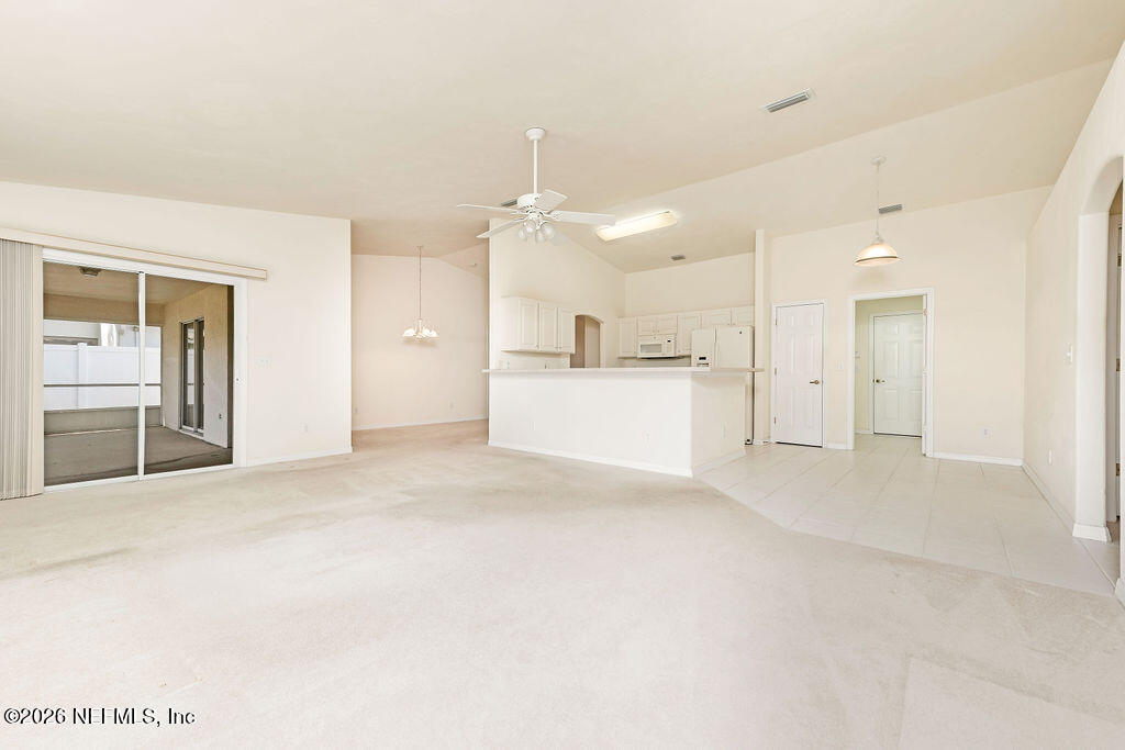 8 Peruvian Lane Ormond Beach, FL 32174 - Photo 6 of 40 a view of a kitchen with a sink and a refrigerator