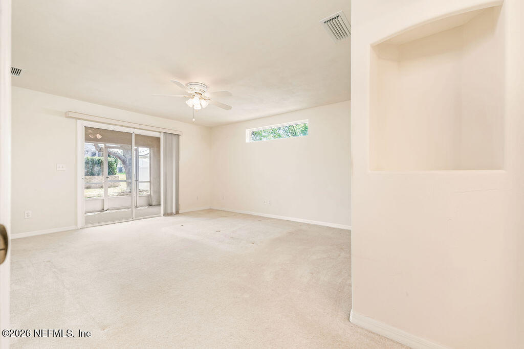 8 Peruvian Lane Ormond Beach, FL 32174 - Photo 10 of 40 a view of an empty room with a window