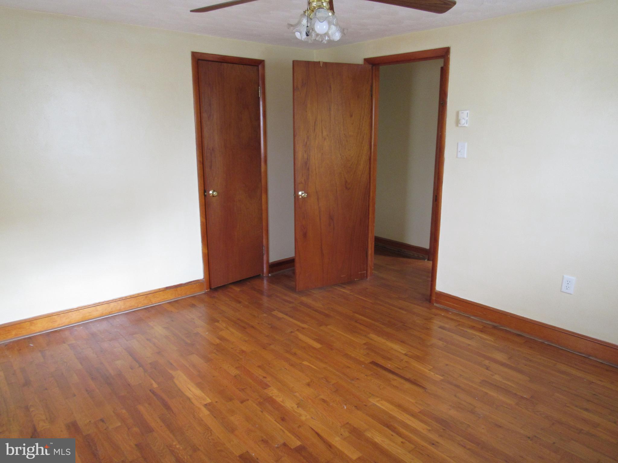 110 West 6th Avenue Ranson, WV 25438 - Photo 14 of 27 a view of an empty room with wooden floor