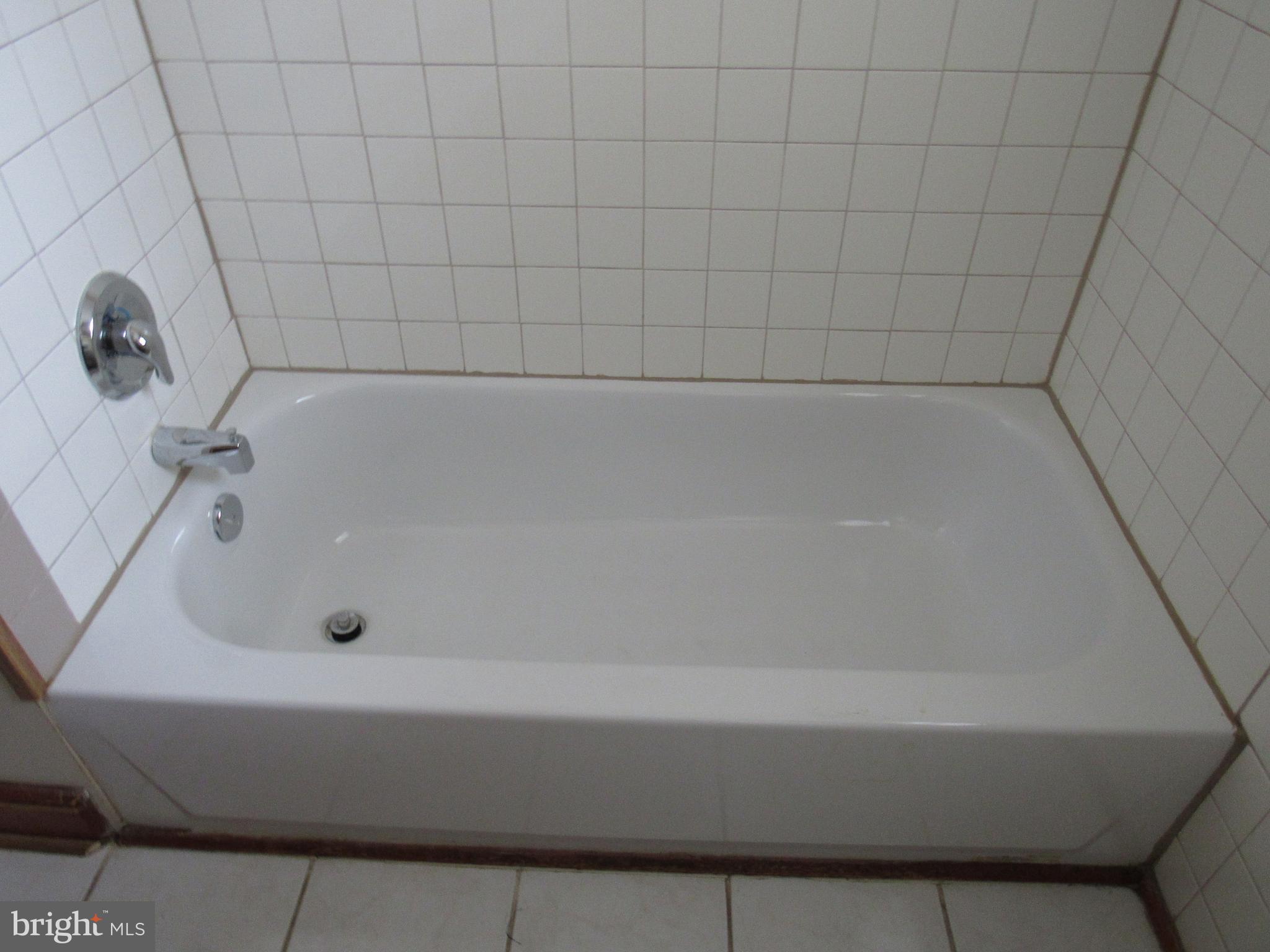 110 West 6th Avenue Ranson, WV 25438 - Photo 18 of 27 a bathroom with a bathtub