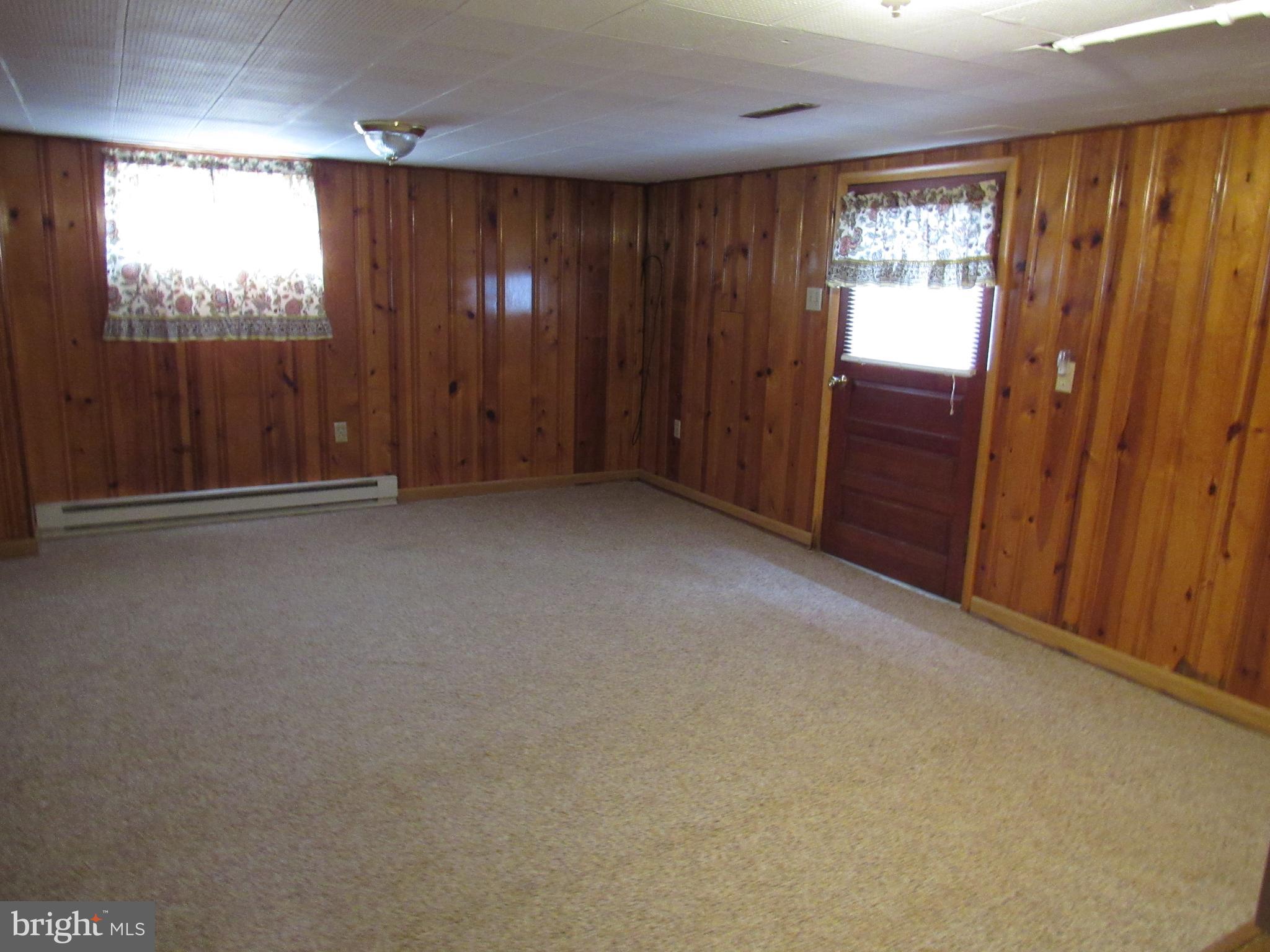 110 West 6th Avenue Ranson, WV 25438 - Photo 22 of 27 an empty room with windows door and outdoor space