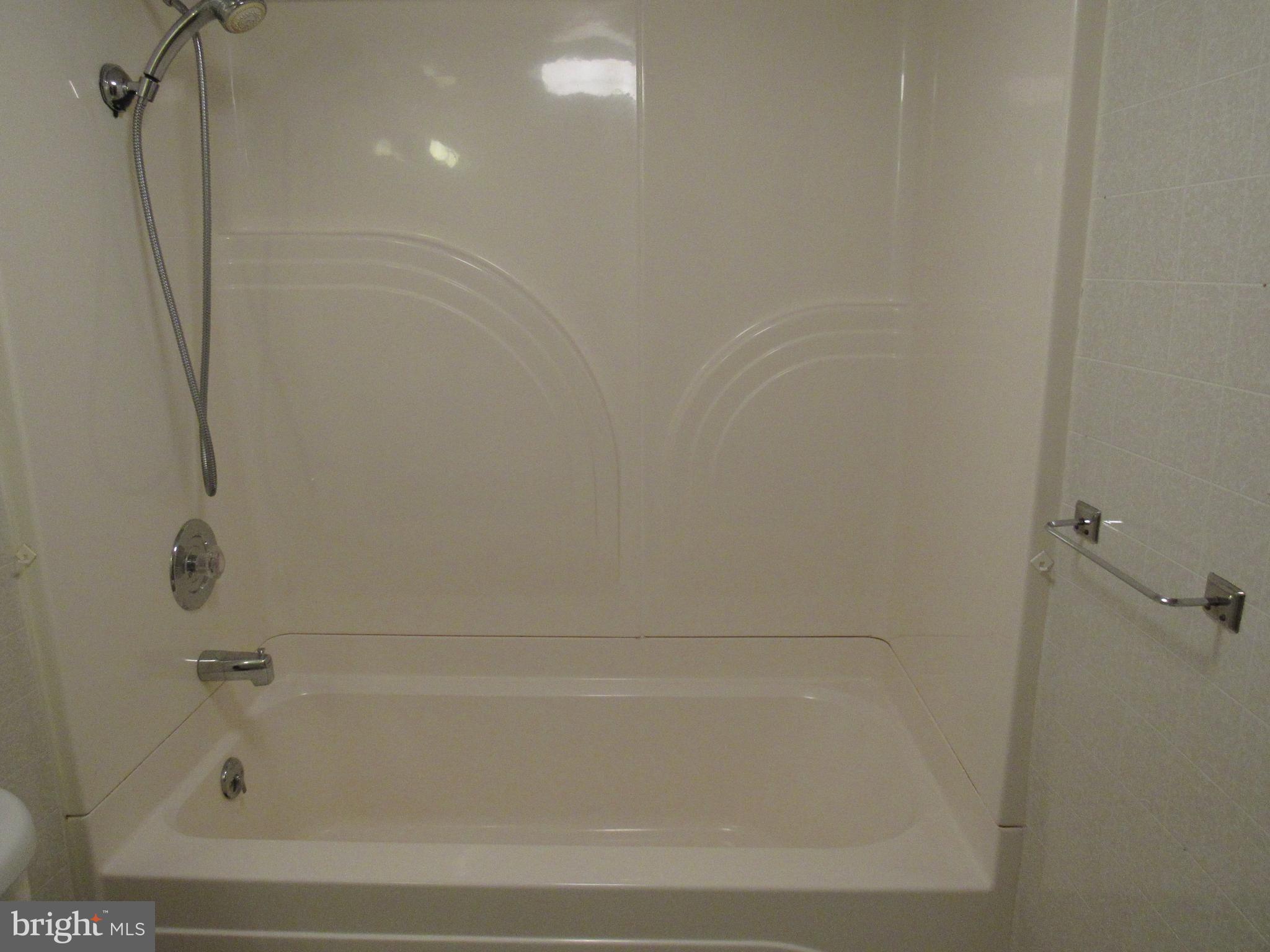 110 West 6th Avenue Ranson, WV 25438 - Photo 25 of 27 a bathroom with a bathtub