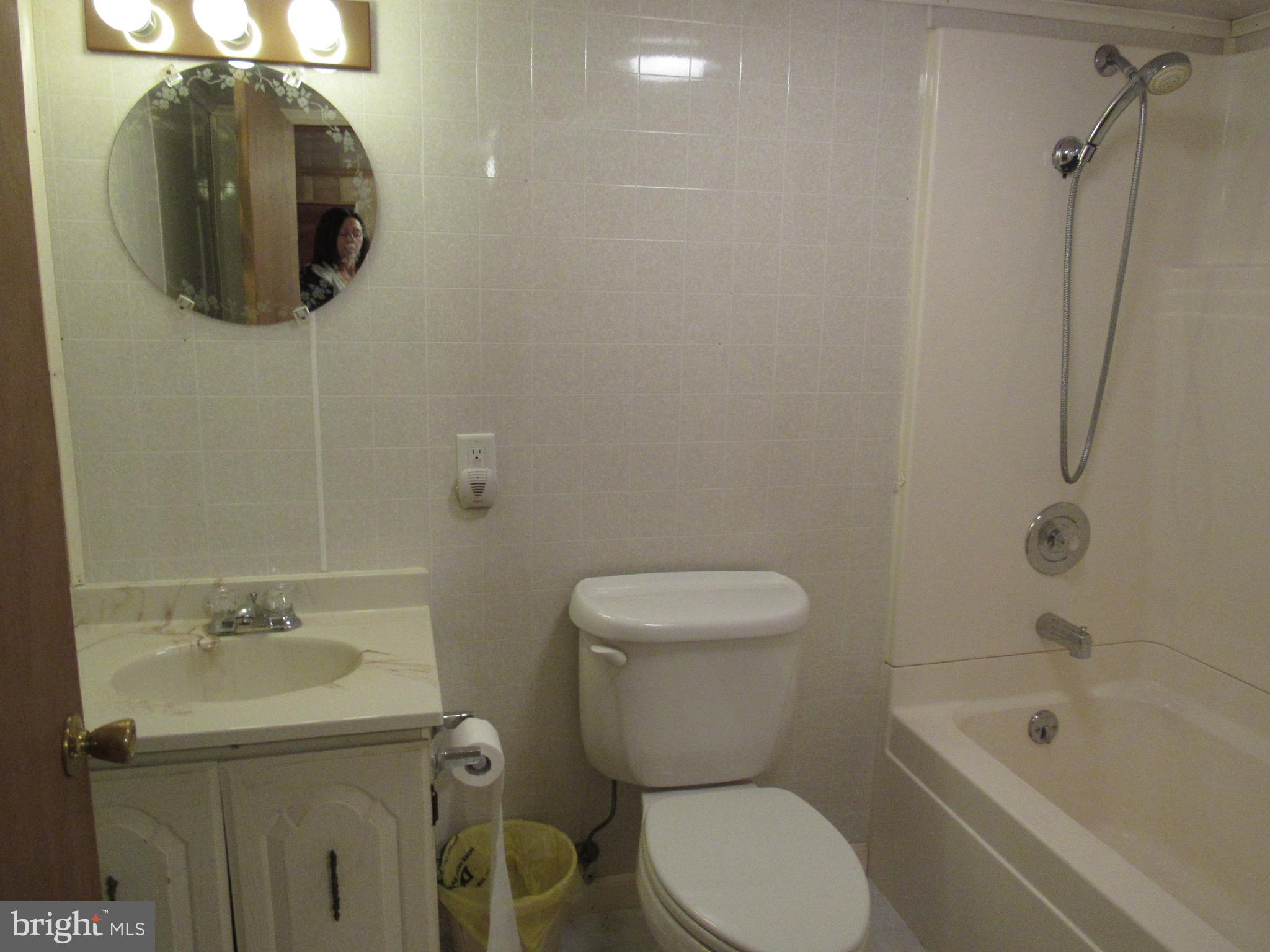 110 West 6th Avenue Ranson, WV 25438 - Photo 26 of 27 a bathroom with a toilet sink and mirror