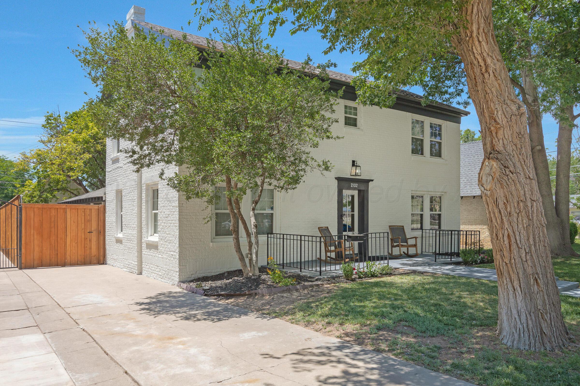 2102 South Hayden Street Amarillo, TX 79109 - Photo 2 of 44 a view of a house with backyard and trees