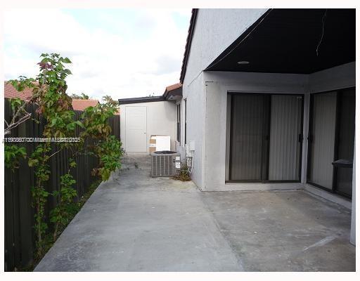 4860 Southwest 152nd Place, Unit F92 Miami, FL 33185 - Photo 4 of 6 a view of a house with backyard