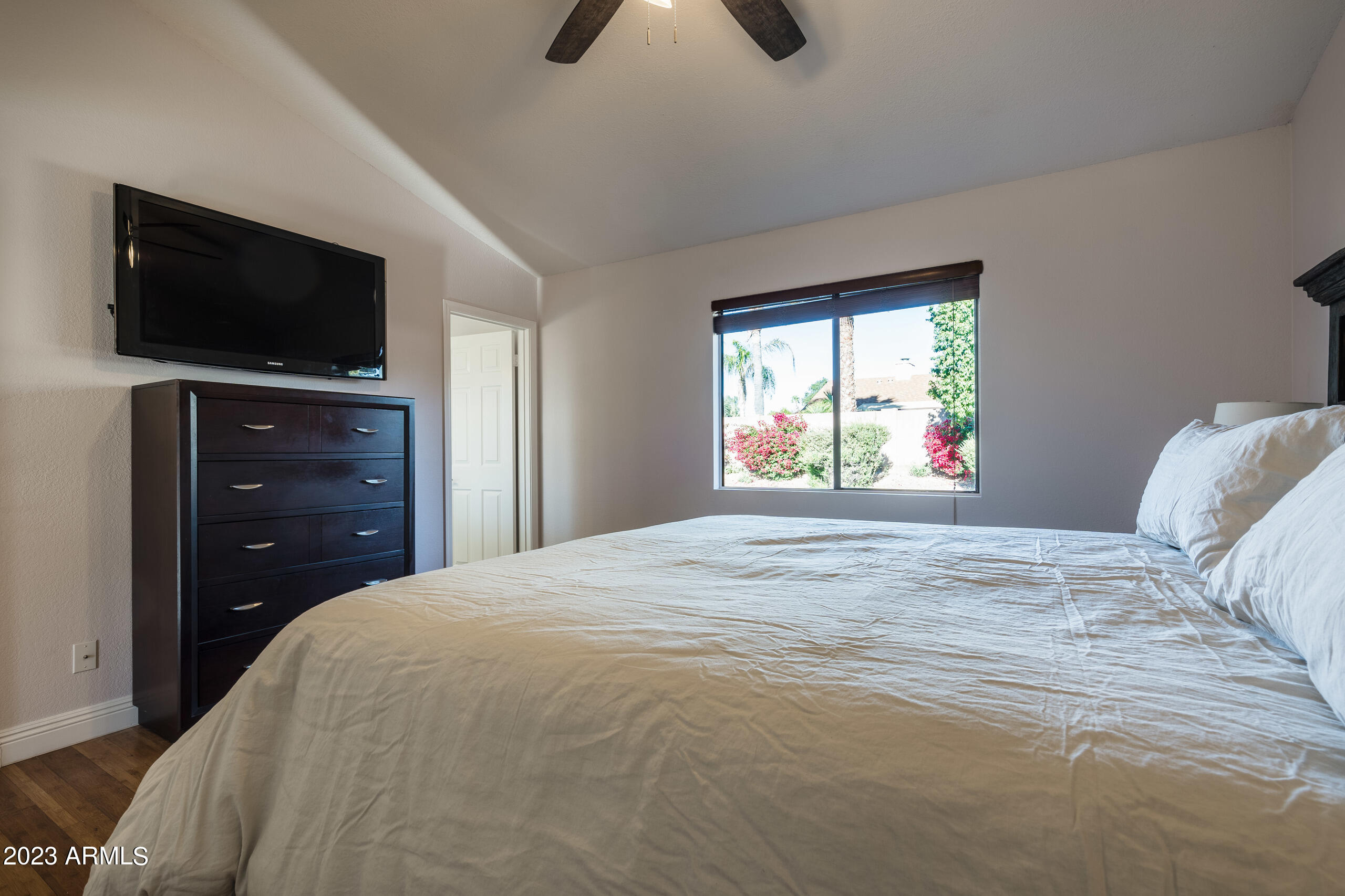 6444 East Sandra Terrace Scottsdale, AZ 85254 - Photo 12 of 22 a bedroom with a bed and a flat screen tv
