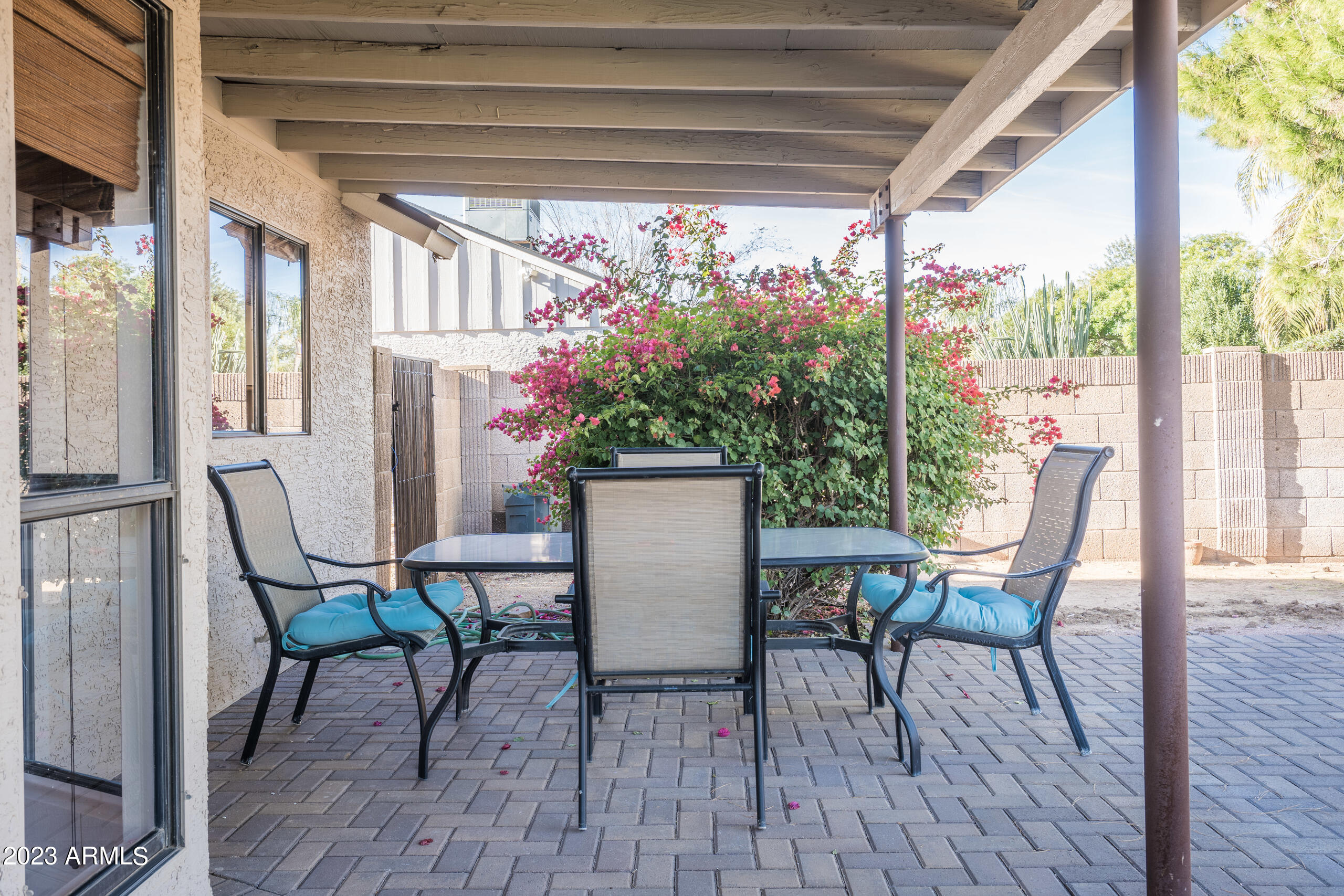 6444 East Sandra Terrace Scottsdale, AZ 85254 - Photo 18 of 22 a view of a dining room with furniture window and wooden floor