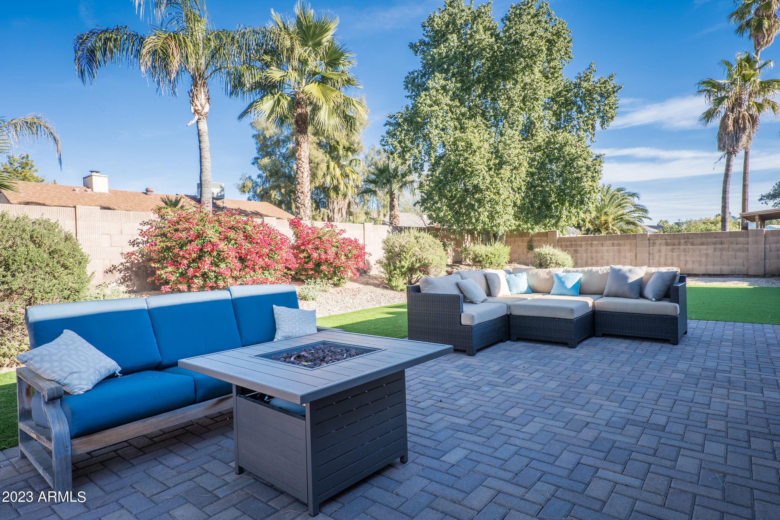 6444 East Sandra Terrace Scottsdale, AZ 85254 - Photo 20 of 22 a view of a patio with couches and a fire pit