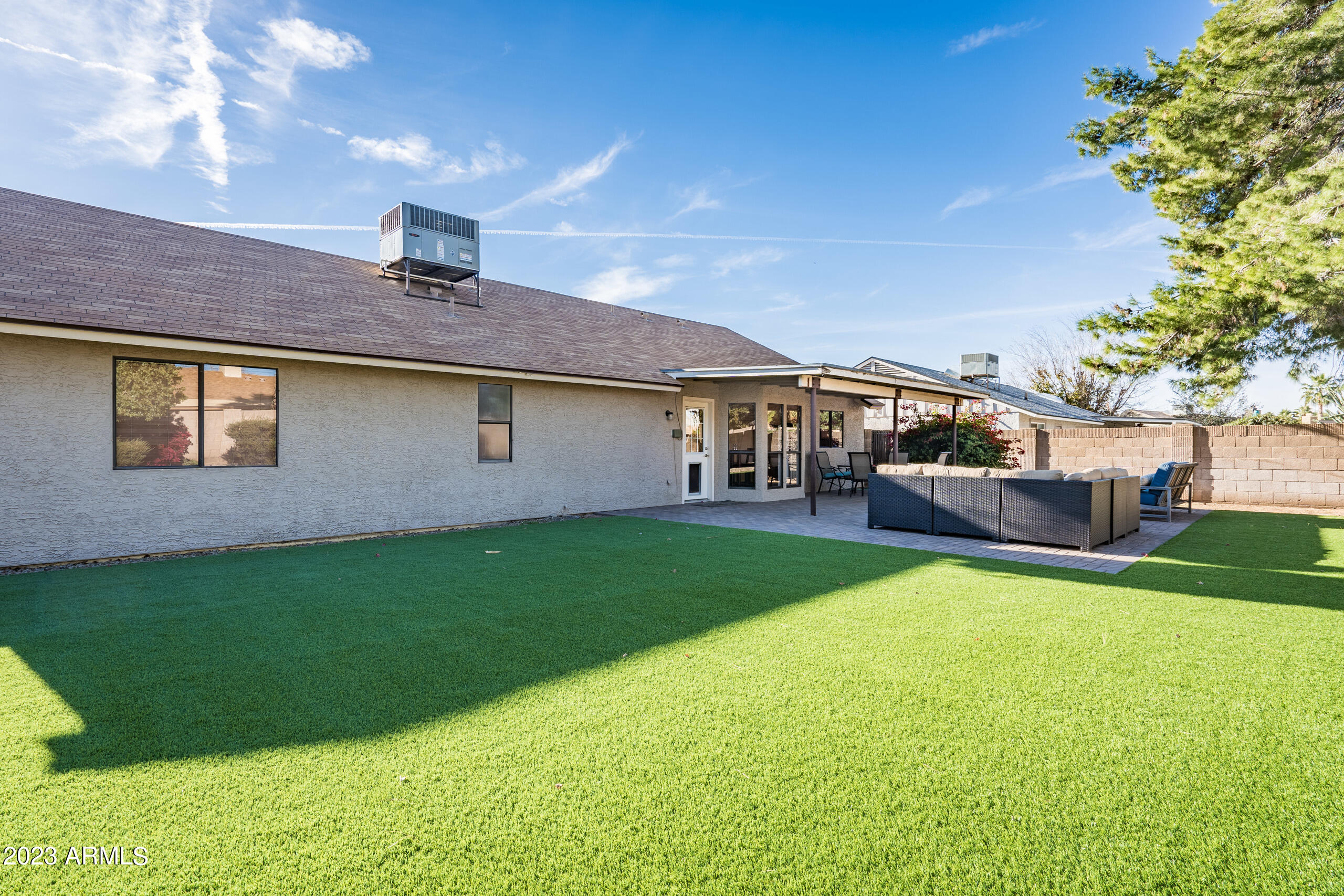 6444 East Sandra Terrace Scottsdale, AZ 85254 - Photo 22 of 22 a view of a house with a backyard porch and sitting area