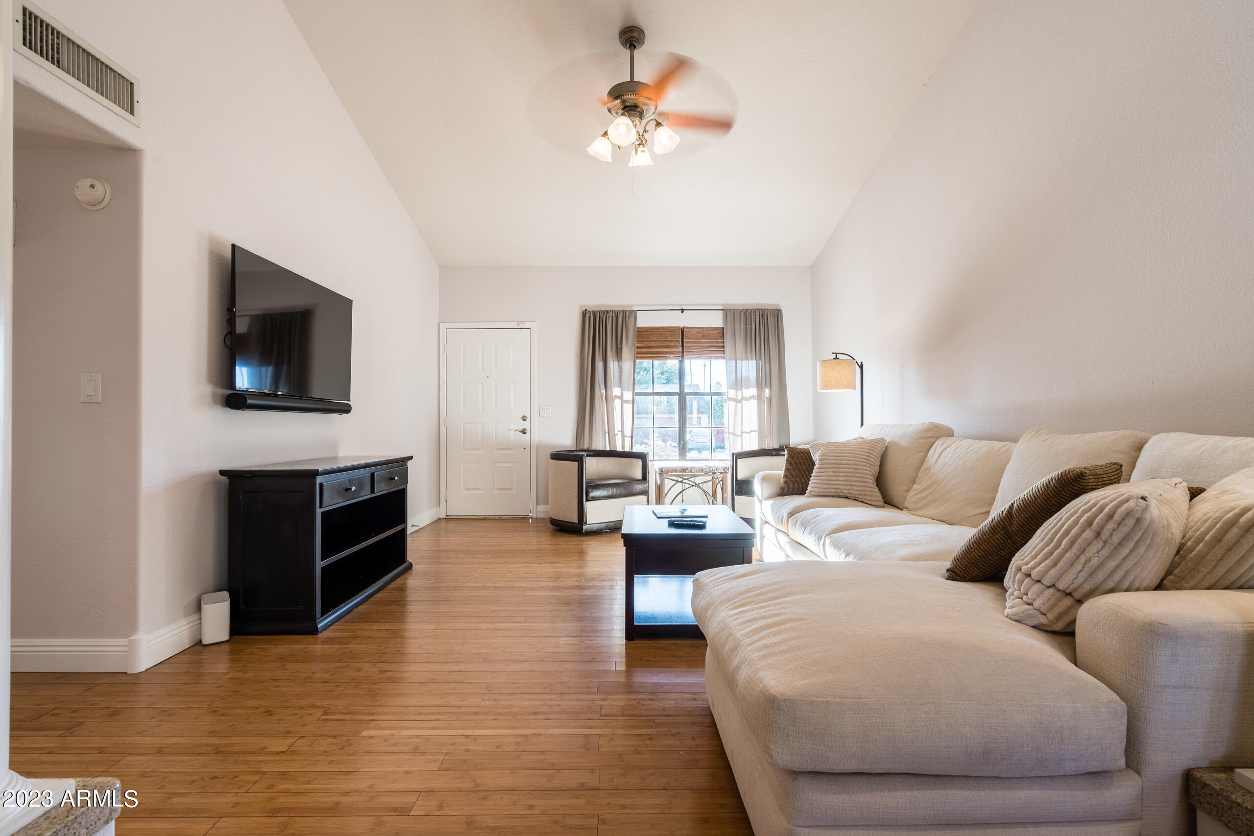 6444 East Sandra Terrace Scottsdale, AZ 85254 - Photo 4 of 22 a living room with furniture and a flat screen tv