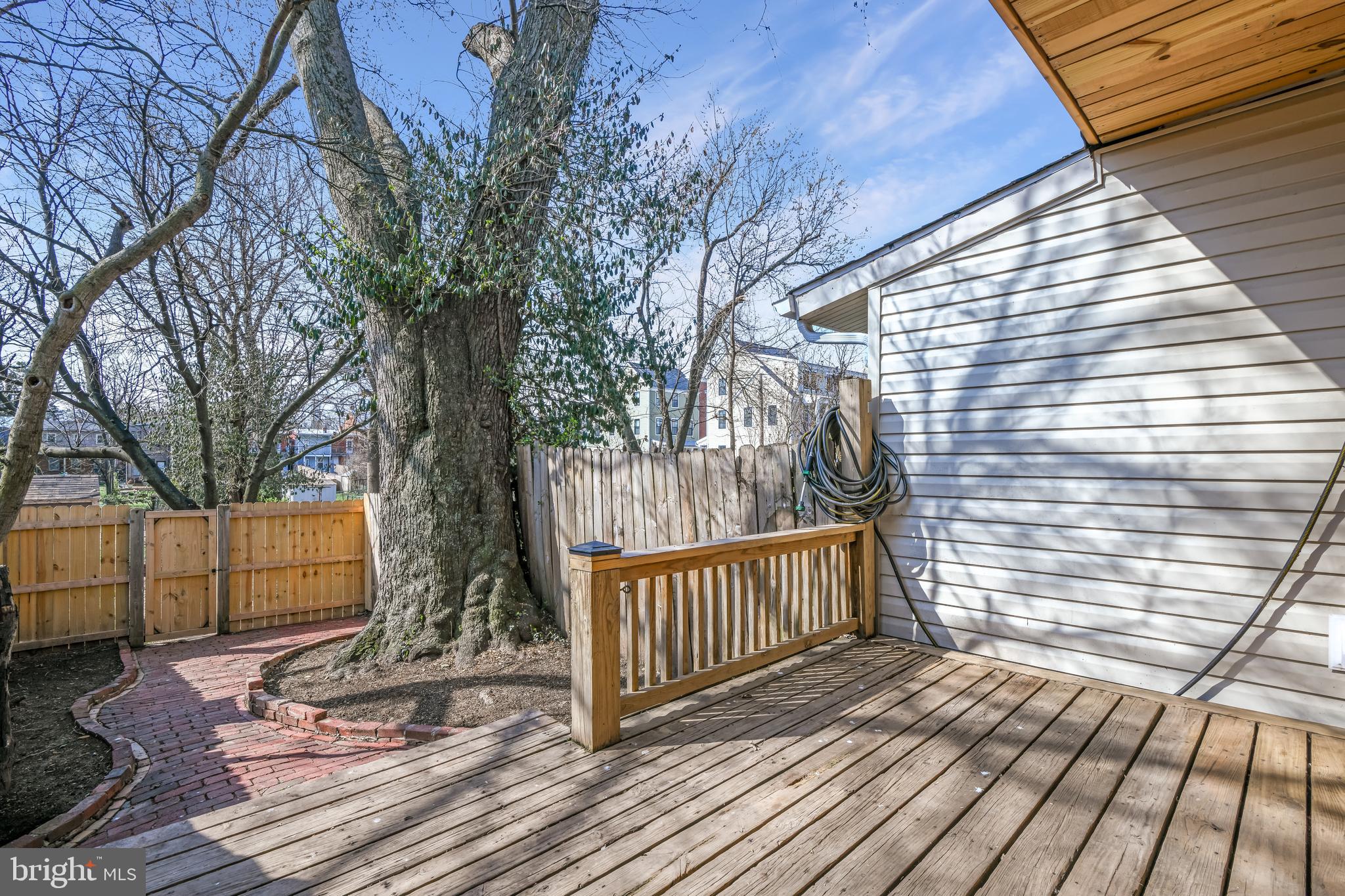230 East 5th Street Frederick, MD 21701 - Photo 18 of 24 a view of a balcony with wooden floor and fence