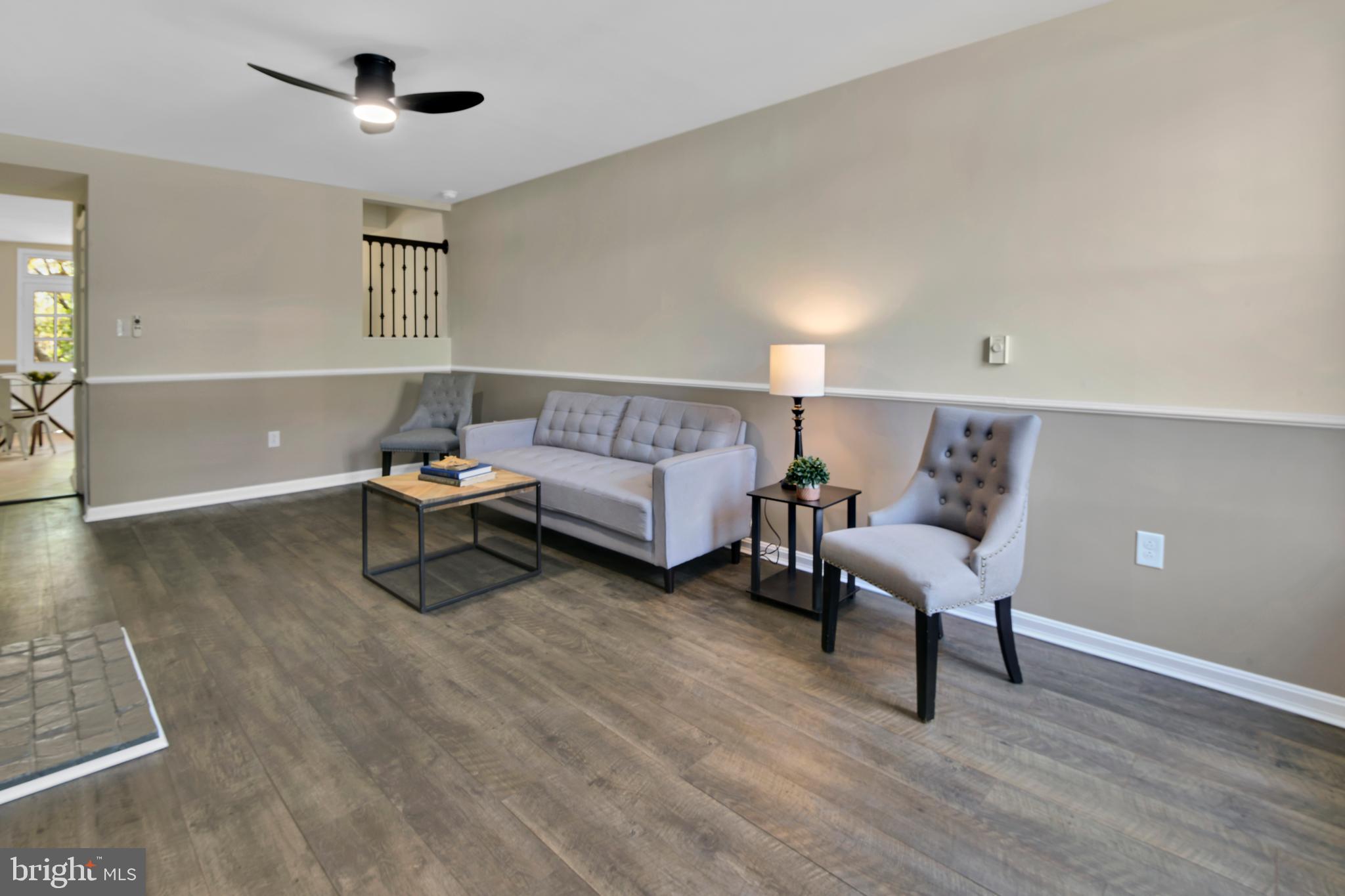 230 East 5th Street Frederick, MD 21701 - Photo 6 of 24 a living room with furniture and a wooden floor