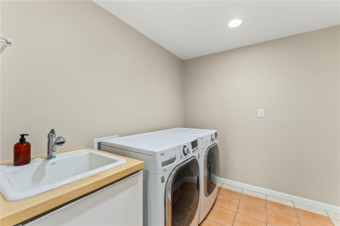 2247 East Whipp Road Dayton, OH 45440 - Photo 41 of 52 This dedicated utility room offers convenient laundry solutions and practical workspace.